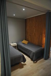 a bedroom with two beds and a window at Apartment for six near Railway station in Rovaniemi