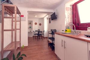 a kitchen with a sink and a counter top at Casa do Largo de NaturAlegre in Alegrete