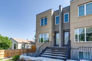 a house with a staircase in front of it at Cozy Denver Vacation Rental Near Broncos Stadium! in Denver