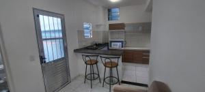 Η κουζίνα ή μικρή κουζίνα στο Casa de Hóspedes em Parque Pinheiros - Sem Garagem +27 φωτογραφίες