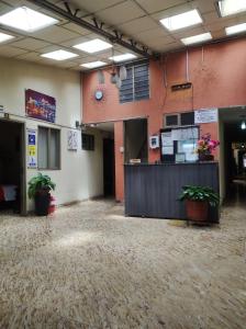 a large room with a counter and plants in it at Hotel Casa Real 2 in Popayan