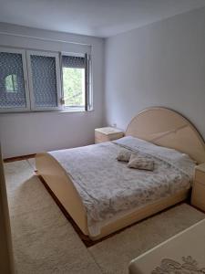a bedroom with a large bed in a room at A&A Apartment in Skopje