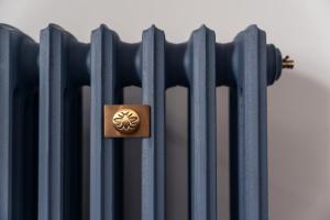 a metal fence with a brass emblem on it at 59 Windermere Road, Kendal in Kendal