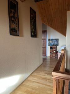 a hallway of a house with two pictures on the wall at Vabaduse Guesthouse in Narva-Jõesuu