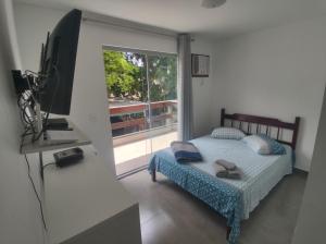 Postel nebo postele na pokoji v ubytování Residencial 101 Ilha Grande