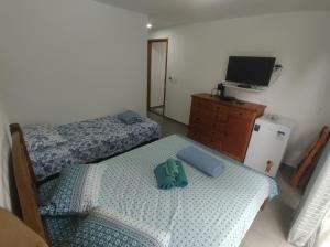 Postel nebo postele na pokoji v ubytování Residencial 101 Ilha Grande