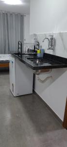 Kuchyň nebo kuchyňský kout v ubytování Residencial 101 Ilha Grande