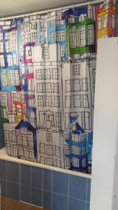 a curtain on a wall in a bathroom at Appartement FX 3 in Saint Die