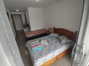 Postel nebo postele na pokoji v ubytování Residencial 101 Ilha Grande