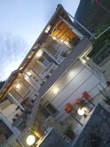 an overhead view of a white house with lights at VILA CANI in Tepelenë