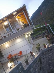 an overhead view of a building with tables and chairs at VILA CANI in Tepelenë