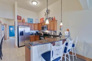 a kitchen with a counter and a refrigerator at C309 - Sounds Good 309 in Nags Head