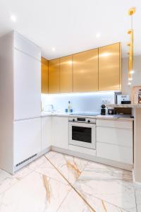 Kuchyňa alebo kuchynka v ubytovaní Apartament Chanel Jana Pawła