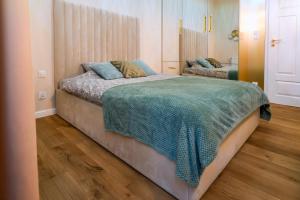 Posteľ alebo postele v izbe v ubytovaní Apartament Chanel Jana Pawła