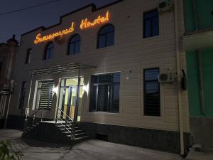 a neon sign on the side of a building at Samarkand Hostel in Samarkand