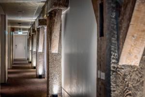 an empty hallway in an old building with columns at Quality Hotel Waterfront in Ålesund