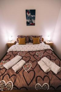 a bedroom with a bed with hearts on it at Jelenin konak in Nova Varoš