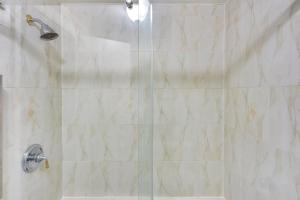 a bathroom with a shower with a glass door at Cozy Albany Vacation Rental about 5 Mi to Downtown! in Albany +19 photos