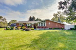 a brick house with a large yard at Cozy Albany Vacation Rental about 5 Mi to Downtown! in Albany