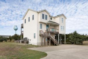 a large white house with a water tower at 7030 - Waves Against the Machine by Resort Realty in Rodanthe