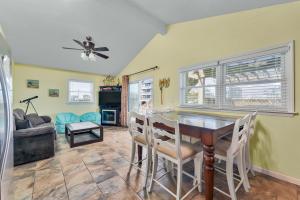a dining room with a table and chairs at 7039 - A Wave From It All by Resort Realty in Rodanthe