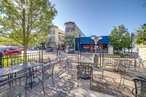 a group of tables and chairs on a city street at Phoenix Nest South Haven Condo River View! in South Haven