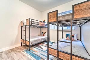 two bunk beds in a room with wooden floors at Modern w Best Mtn Views, HotTub, Pool table in Durango