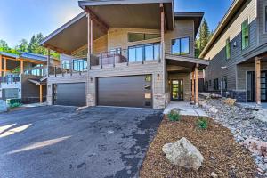 a large house with a garage in front of it at Modern w Best Mtn Views, HotTub, Pool table in Durango
