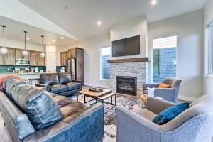 a living room with two couches and a fireplace at Modern w Best Mtn Views, HotTub, Pool table in Durango