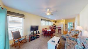 a living room with a couch and a table at Beautiful 2BR 2BA Lakeside Villa with Lake Views in Pawleys Island