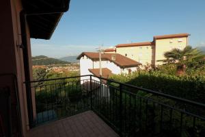 a balcony with a view of a building at Hygge Holiday House in Luino