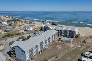 an aerial view of a building next to the ocean at 7051 - Hatteras High 5A by Resort Realty in Rodanthe