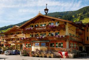 a large building with flowers on the front of it at Der Grubacher in Gerlos