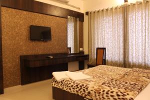 Katil atau katil-katil dalam bilik di Hotel Sai Ramanand