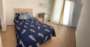 Postel nebo postele na pokoji v ubytování La Isla Bonita
