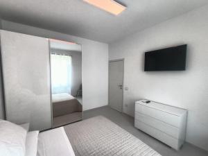 Ένα ή περισσότερα κρεβάτια σε δωμάτιο στο Casa Vacanze Il Divano Rosso