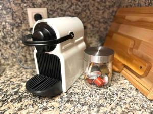 a coffee maker sitting on top of a counter at Apartamento St Agustí - Centro in Mataró