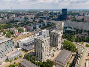 an aerial view of a city with tall buildings at URBAN APARTMENTS LUXURY SKYLINE Sokolska Towers 30A City Center, 2 garages, gym and sauna, IMPREZY ZAKAZANE PARTIES PROHIBITED in Katowice