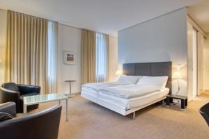 Rúm í herbergi á Hôtel Au Terminus