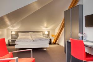 Rúm í herbergi á Hôtel Au Terminus
