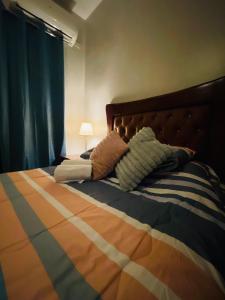 Кровать или кровати в номере Tavalero Rooms