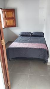 เตียงในห้องที่ Casa en jerico ANTIOQUIA