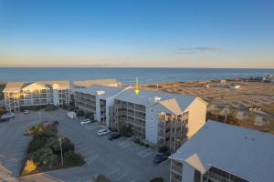 an aerial view of an apartment complex next to the ocean at 7080 - Atlantic Paradise by Resort Realty in Rodanthe