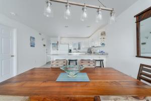 a kitchen with a wooden table with a bowl on it at 7080 - Atlantic Paradise by Resort Realty in Rodanthe