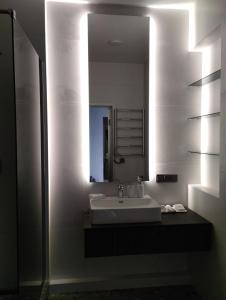 a bathroom with a sink and a mirror at Board apart hotel in Odesa