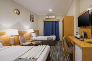 Tempat tidur dalam kamar di Snood Al Maaly Hotel