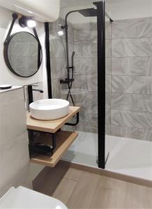a bathroom with a sink and a shower at Jungly / Moderne - Cocooning - Calme - Nature in Saint-Priest