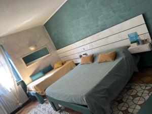 a small room with a bed at Casa Marieta in Sarzana