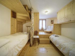 A bed or beds in a room at Villa Corso Italia - Stayincortina