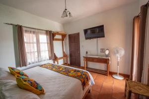 Postel nebo postele na pokoji v ubytování Hotel Camino Antiguo